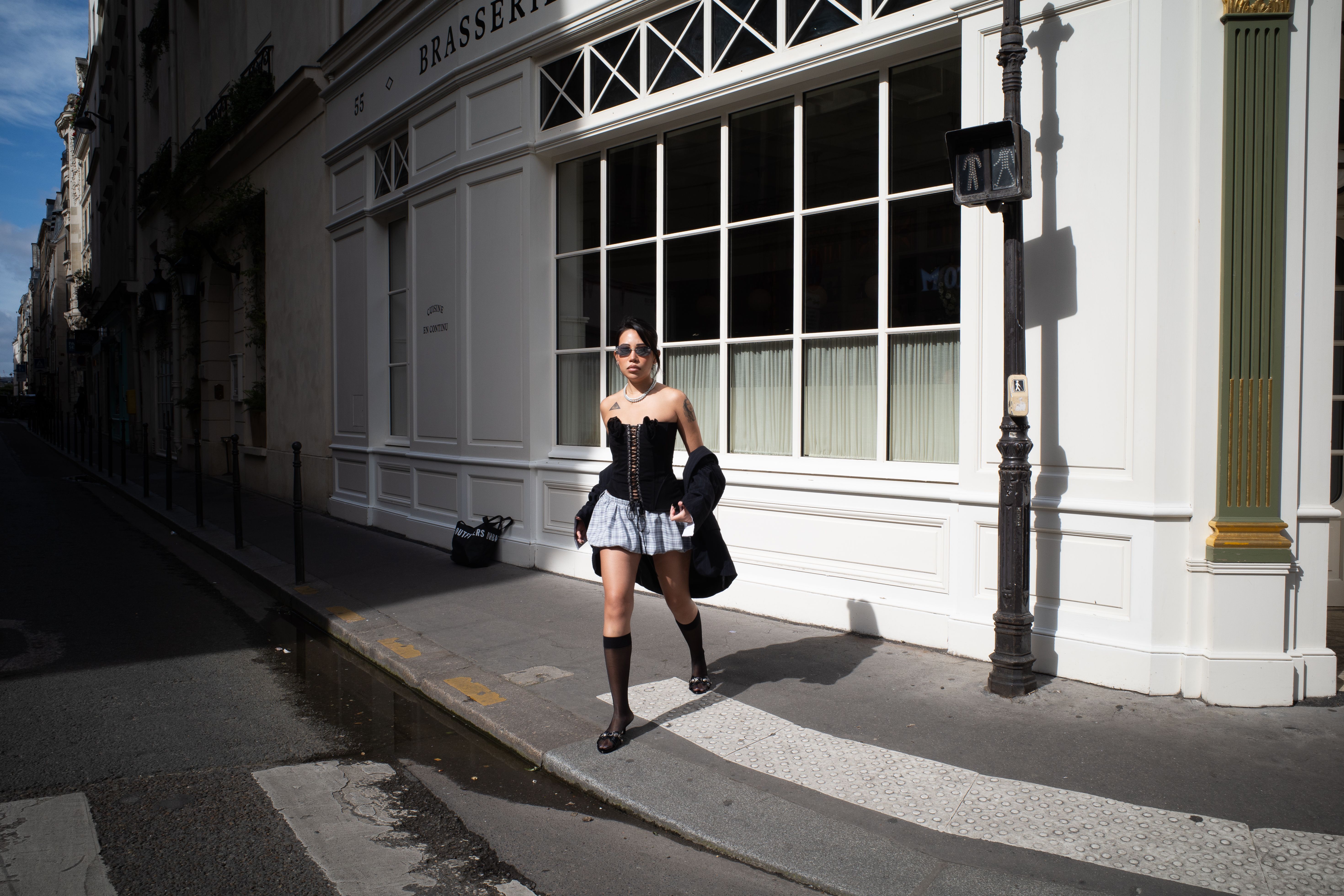 A parisian street style with a woman in a tailored jacket