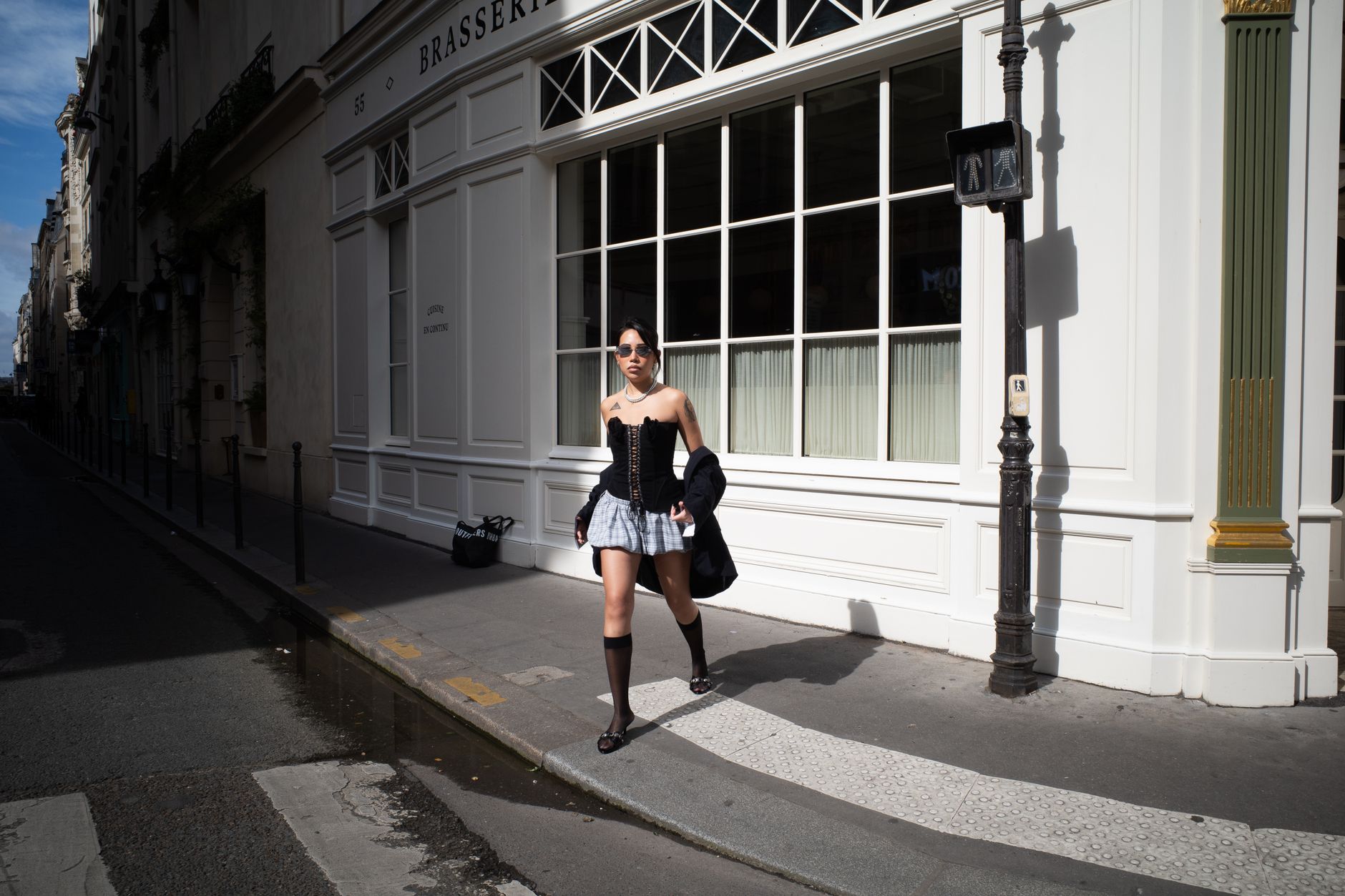 A parisian street style with a woman in a tailored jacket