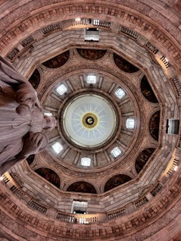 A stunning view of a historic dome interior in Kolkata, showcasing intricate architecture and symmetry.