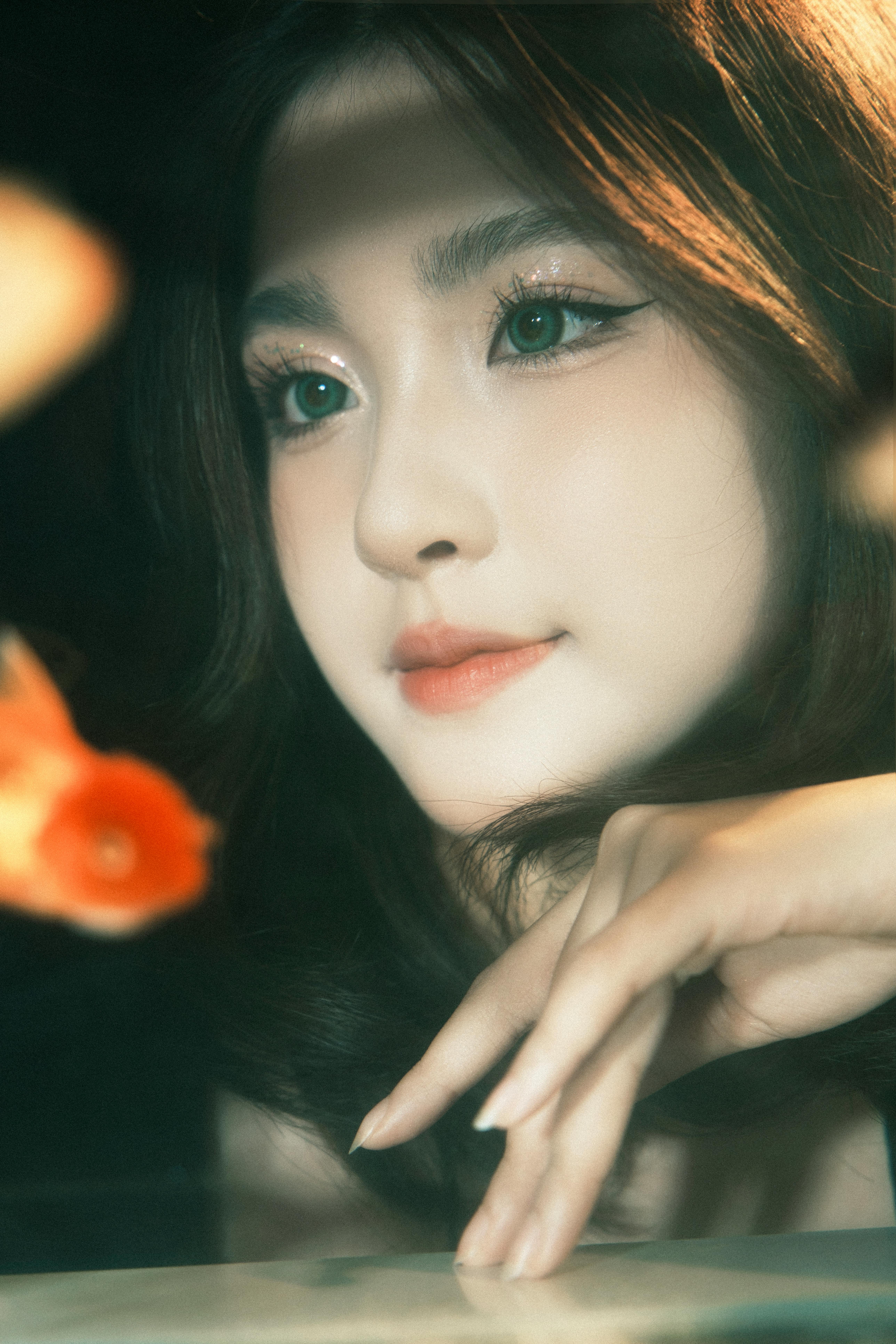 Elegant portrait of a woman with gentle expression, reflecting tranquility with koi fish.