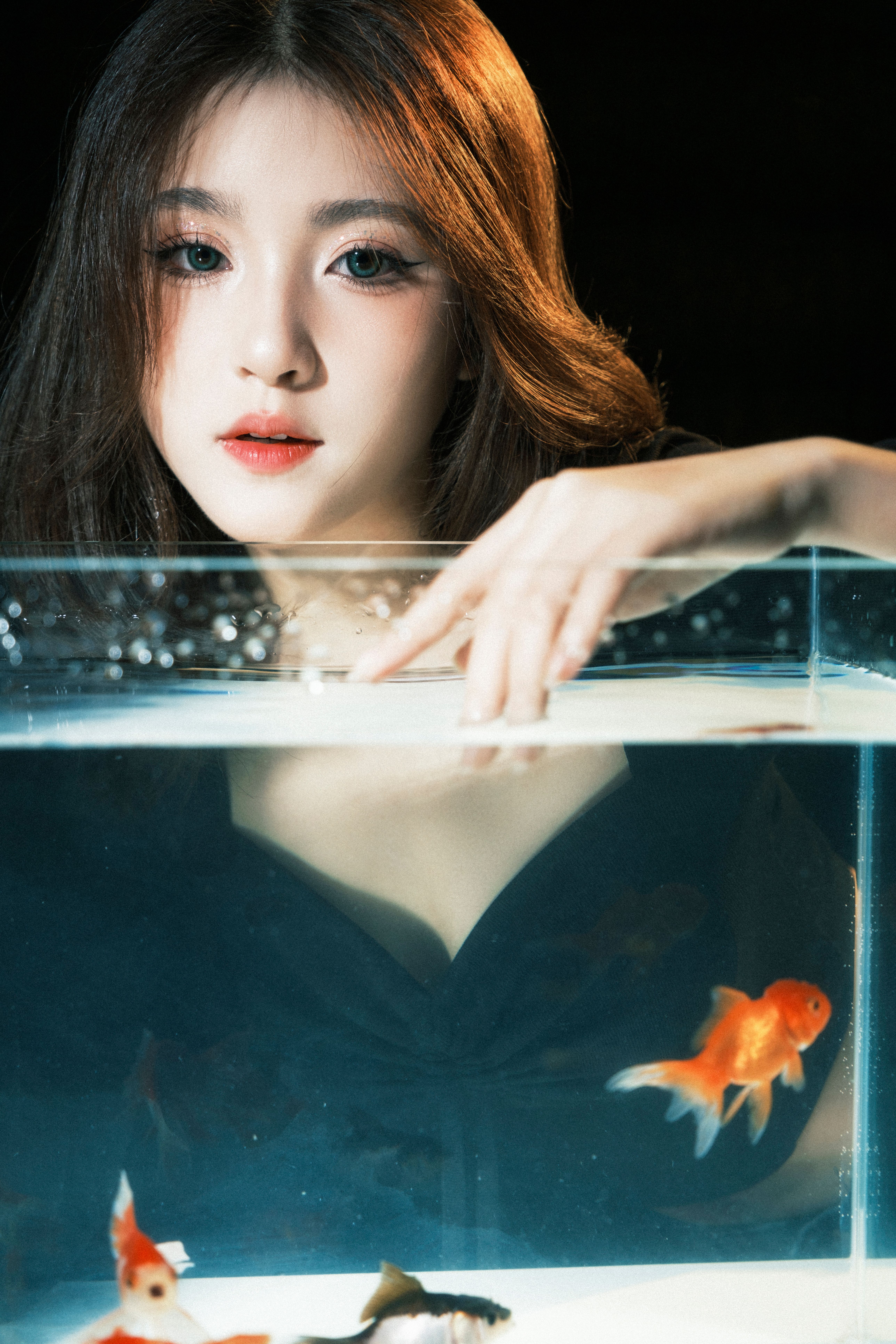 Photo inspiration: Fresh Look at Elegant Portrait With Goldfish In Aquarium