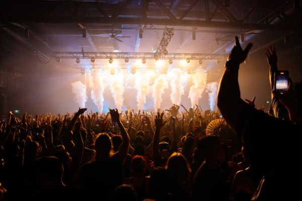 Concert crowd under stage lights — photo by Jeremy Li on Pexels