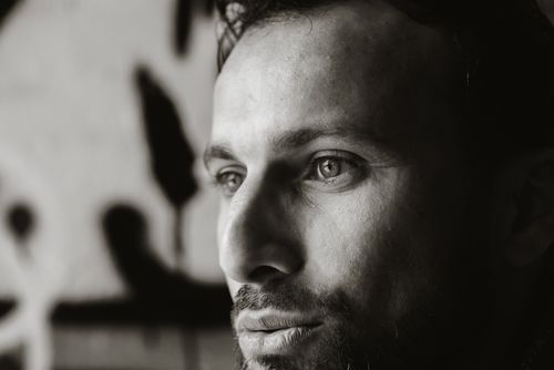 Free Close-up monochrome photo capturing the contemplative expression of a man. Stock Photo