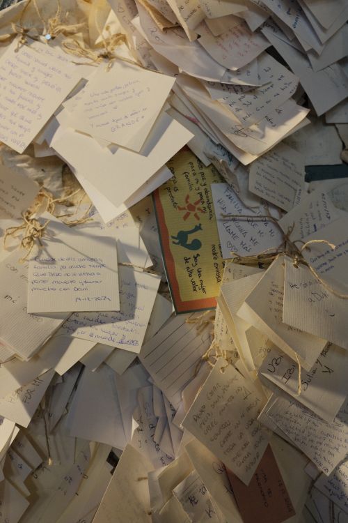 Free Collection of handwritten notes tied with strings, evoking personal sentiments. Stock Photo