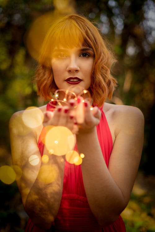 Free Photo Of Woman Holding String Lights Stock Photo