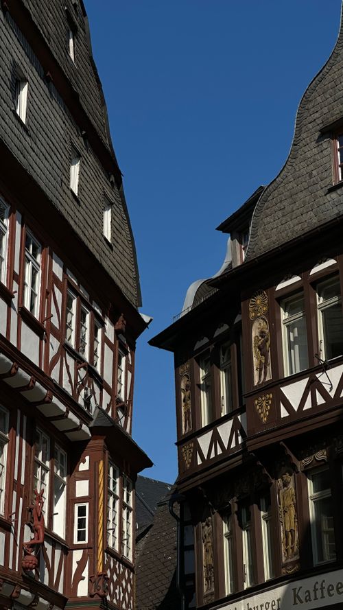 Free Charming medieval half-timbered houses under a clear blue sky in Germany. Stock Photo