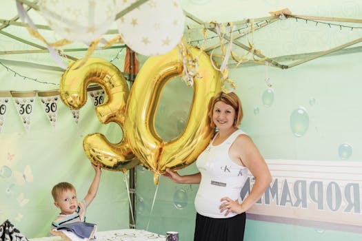 A cheerful 30th birthday party featuring gold balloons and decorations.