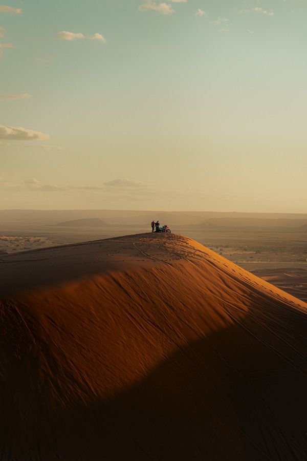 Sand dunes at golden hour — photo by Othmane Ettalbi on Pexels