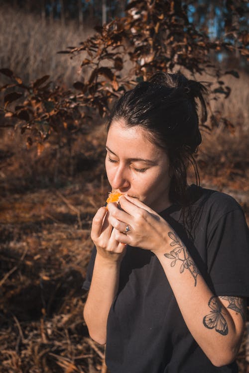 Woman in Black Top Eating 