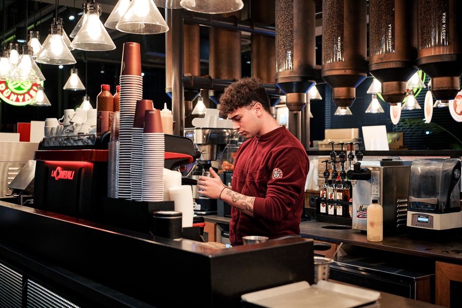 Best cafes coffee shops Athens Greece - barista making coffee in a trendy specialty cafe