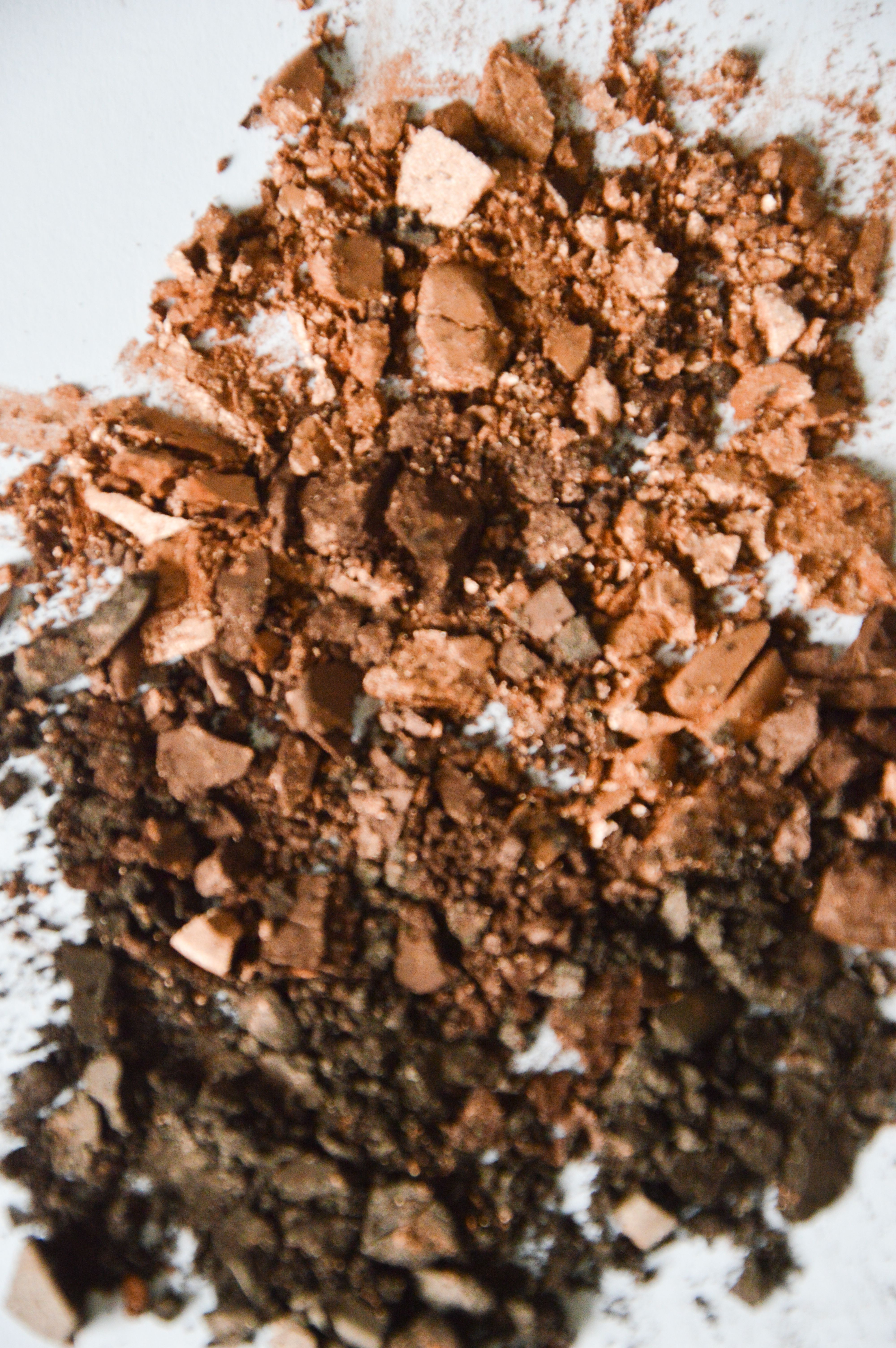 Close-up of Crushed Makeup Powder on White Surface · Free Stock Photo
