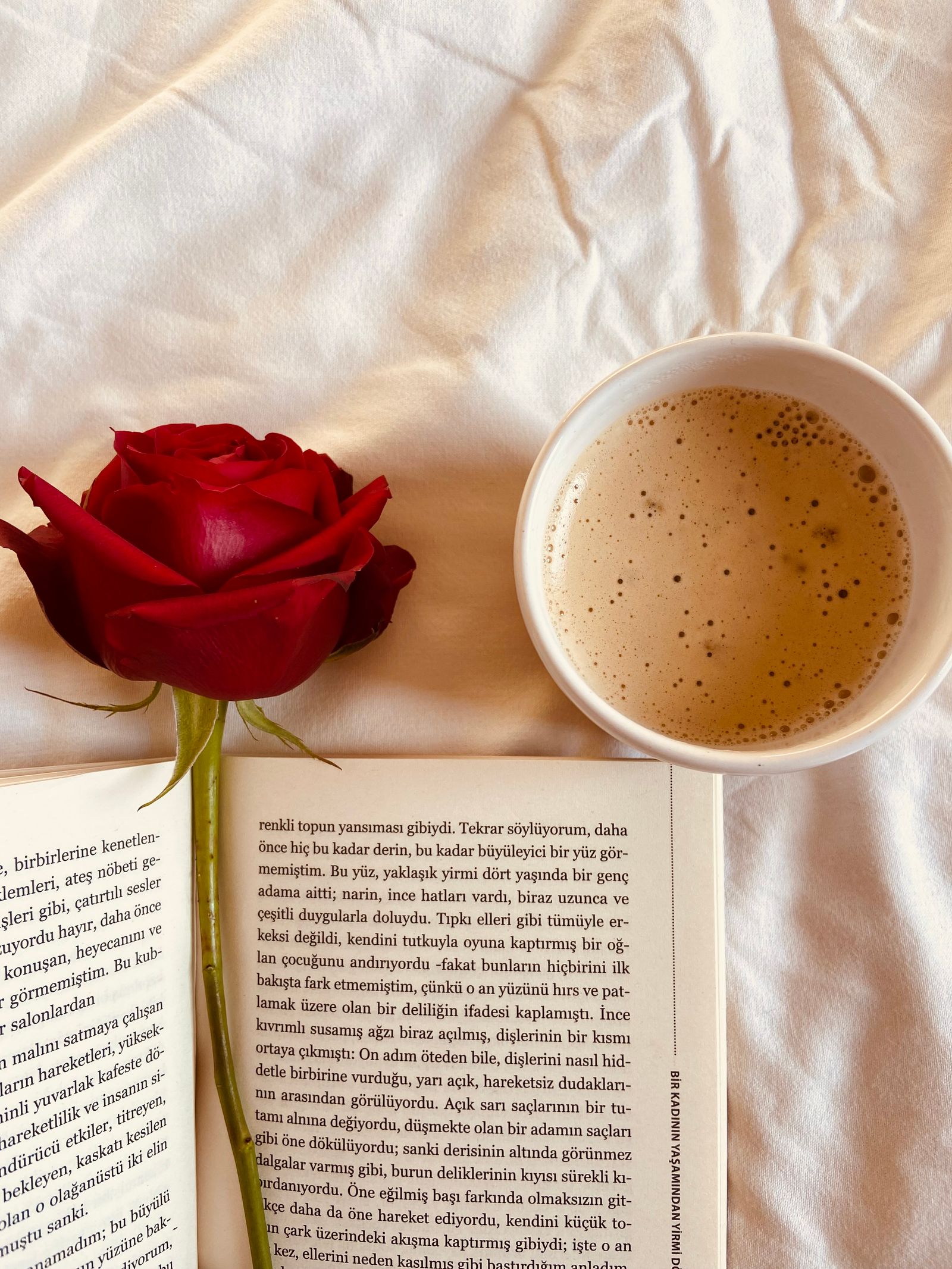 Quiet morning ritual with coffee book and flower