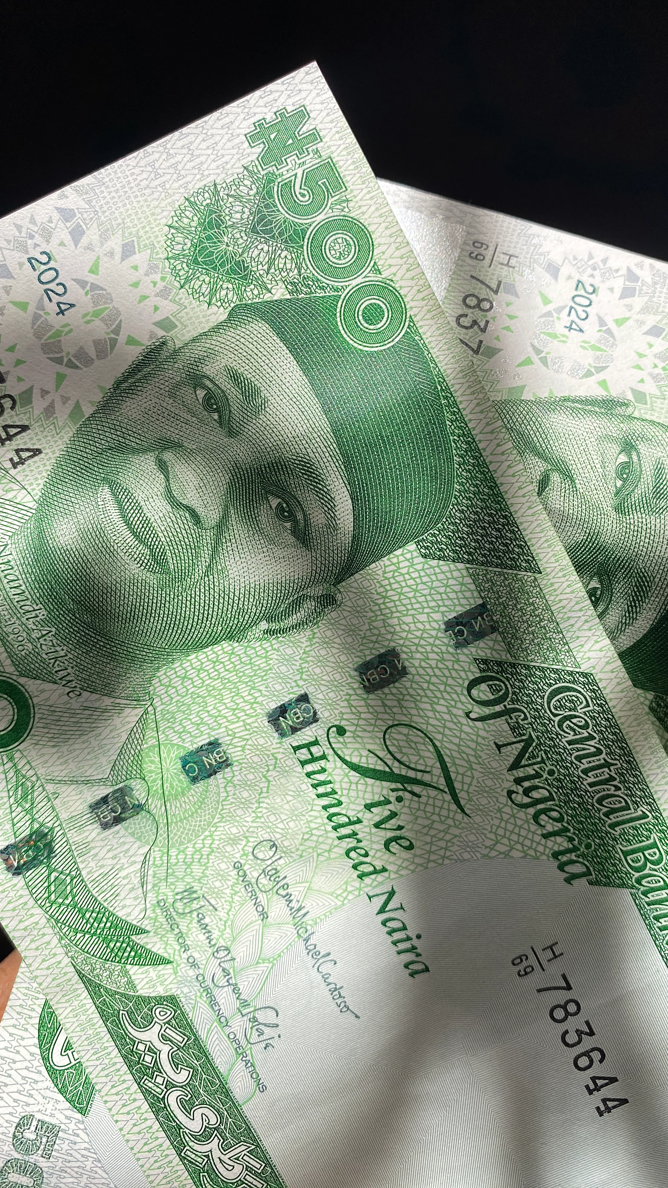 Close-up of Nigerian naira notes symbolizing the impact of monetary policy on everyday finances in Nigeria