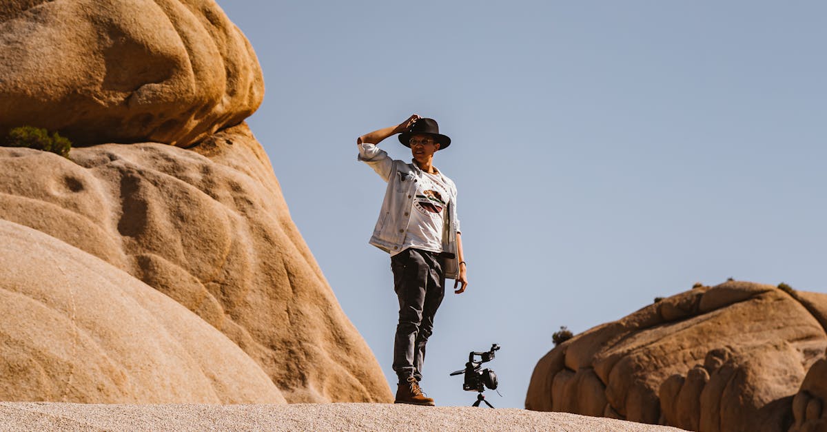Man Standing Near Rocks · Free Stock Photo