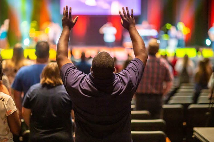 Man Raising His Both Hands