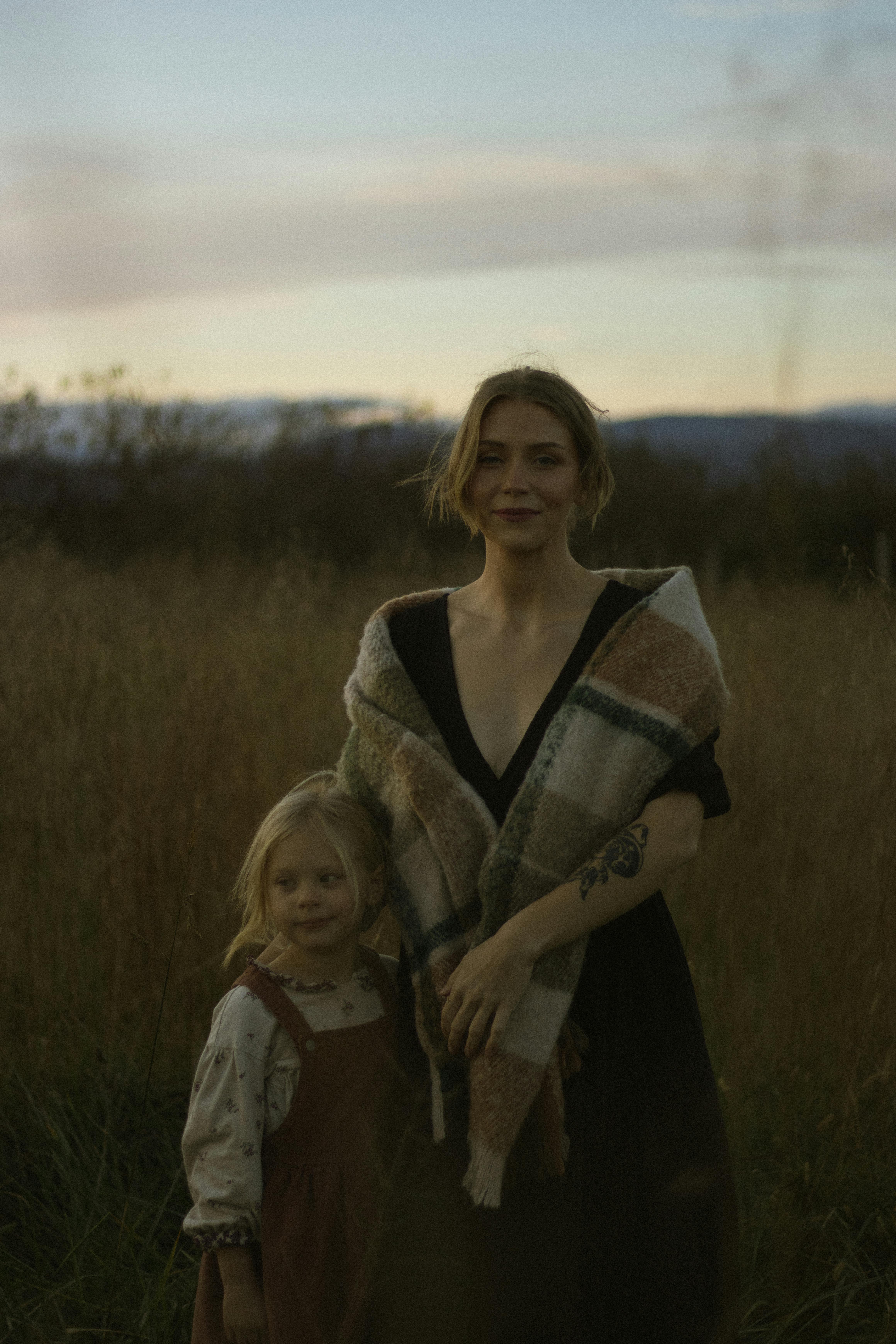 mother and daughter in an evening field portrait