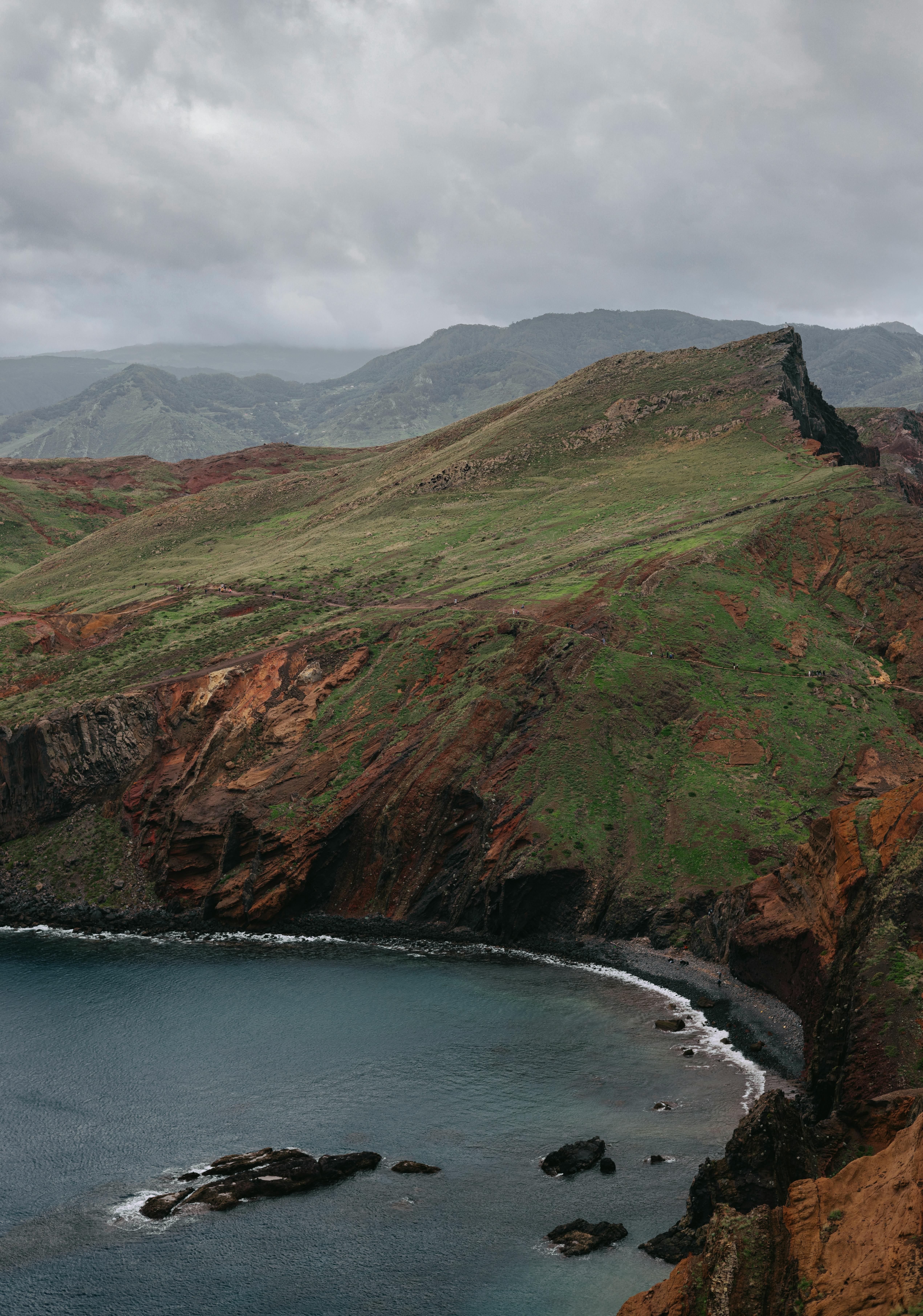 Scenic aerial view of Madeira's rugged coastline with dramatic cliffs and ocean view.