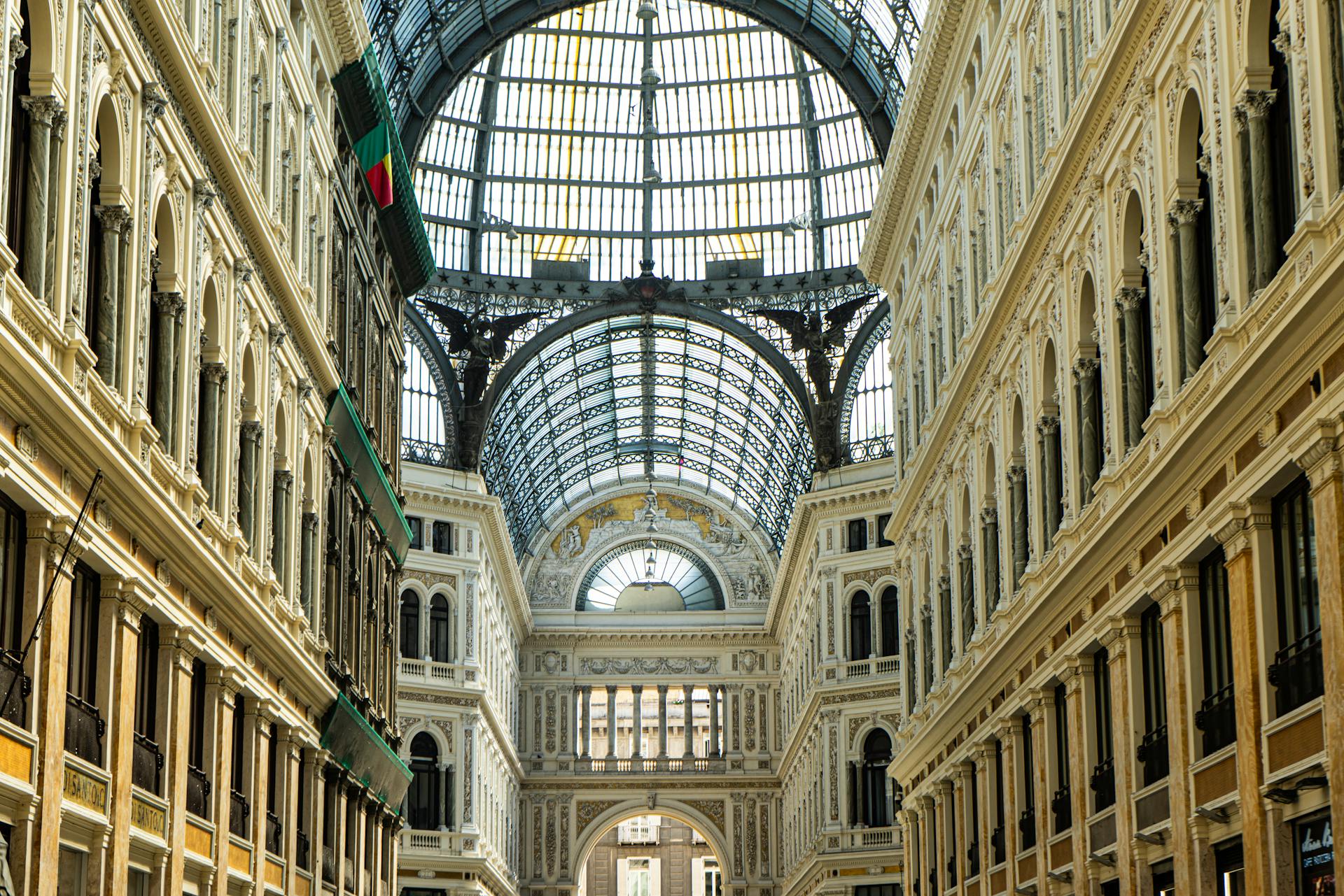 Architectural marvel of Galleria Umberto I in Naples with intricate ceiling and grand design.