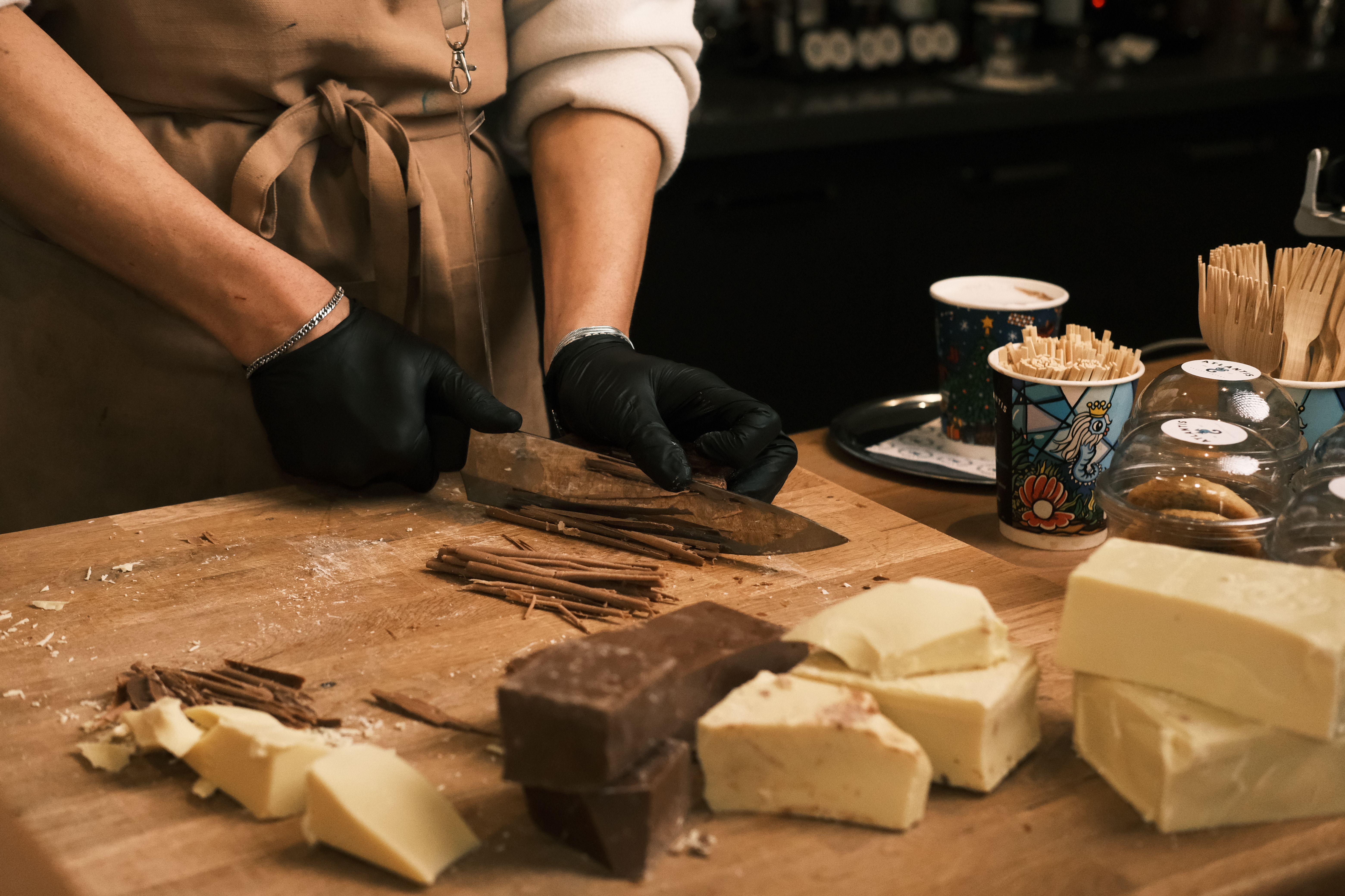 Artist crafting handmade chocolate with ingredients