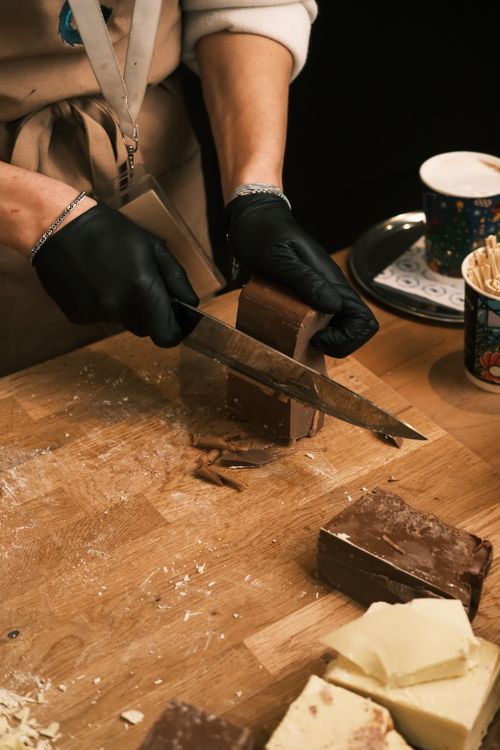 Free Close-up of a person cutting chocolate at a café in Konya, Türkiye. Stock Photo