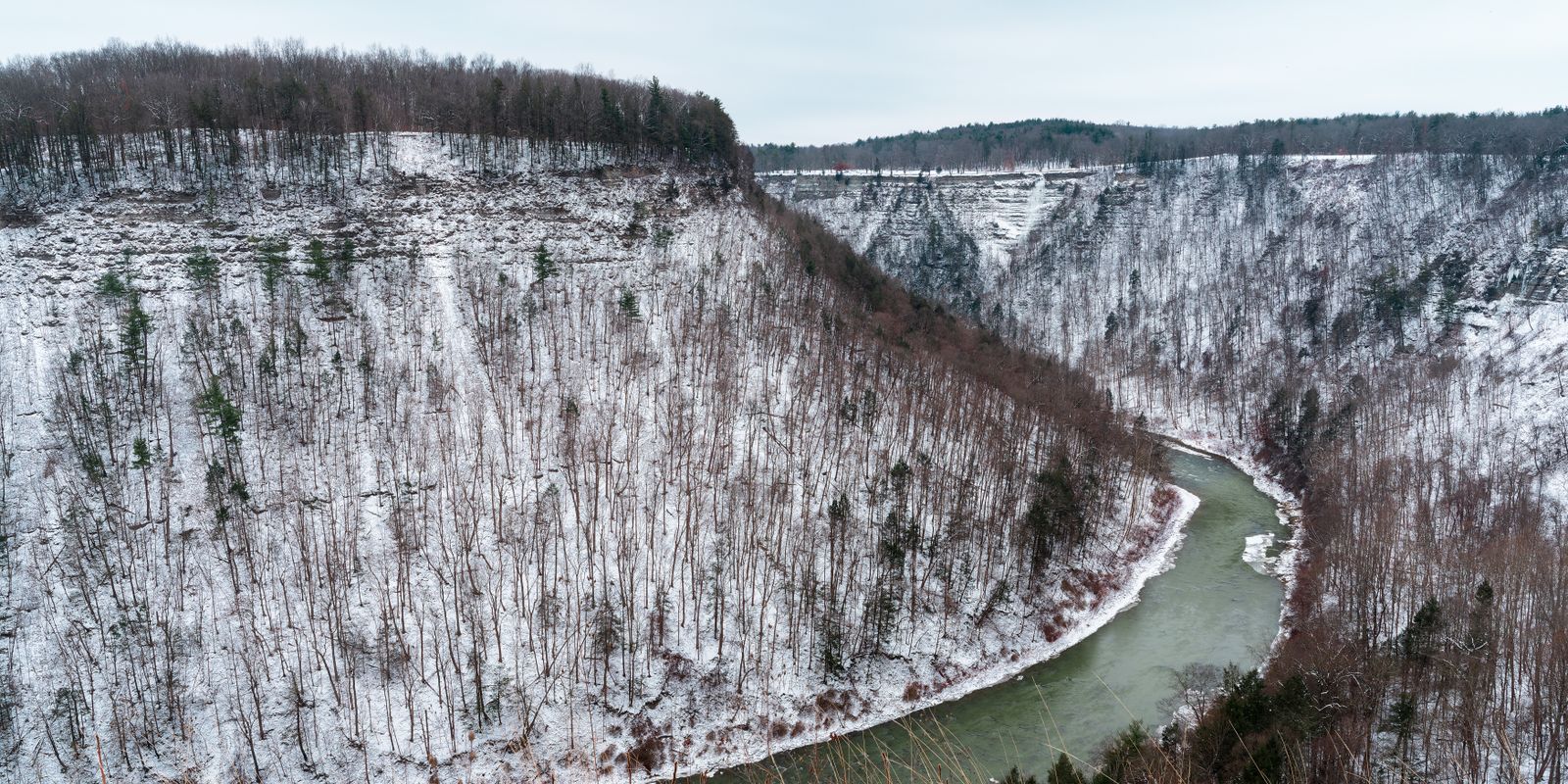 A dramatic gorge with a winding river between steep cliffs