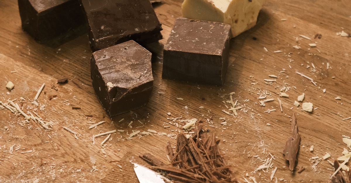 Choco Block Assorted Chocolate Blocks and Shavings on Wooden Counter · Free Stock Photo