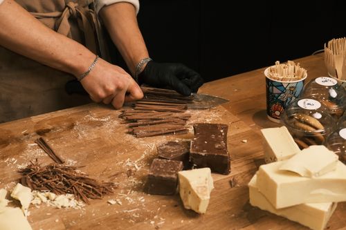 Free Close-up of hands preparing chocolate shavings in trendsetting Konya cafe. Stock Photo