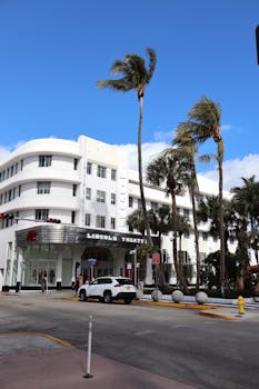 Lincoln Theatre in Miami Beach, showcasing art deco architecture on a sunny day.