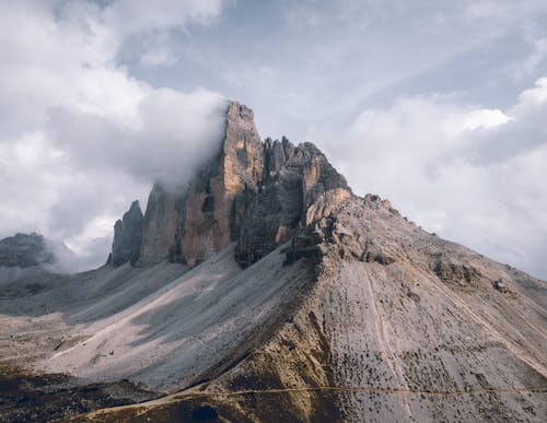 Free Photo Of Mountains Under Cloudy Sky Stock Photo