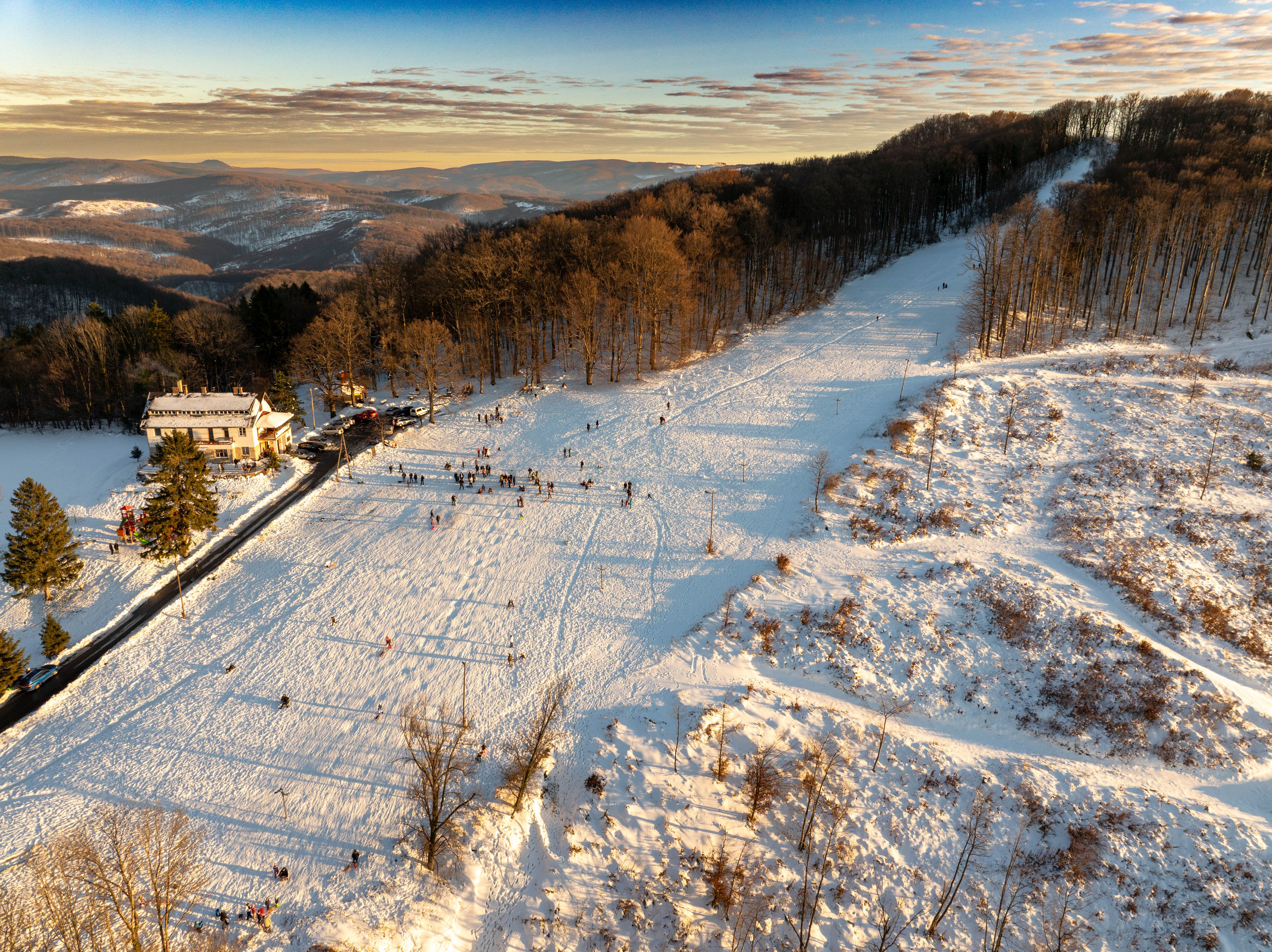 A stunning aerial view of a snowy landscape in Daruvar, Croatia during winter sunset.