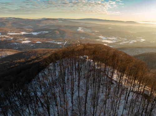 Free A breathtaking aerial view of a snowy forest in Daruvar, Croatia at sunrise, showcasing winter beauty. Stock Photo