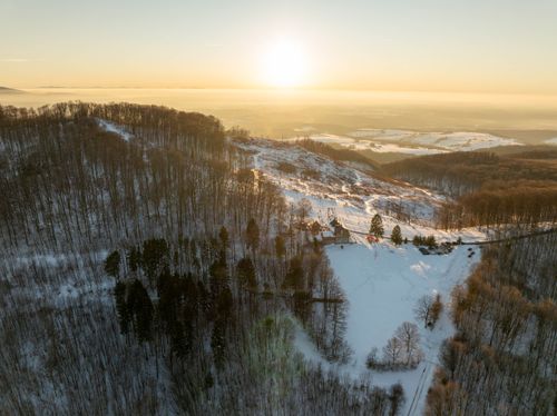 Free A stunning aerial view of a snowy landscape at sunrise in Daruvar, Croatia. Stock Photo