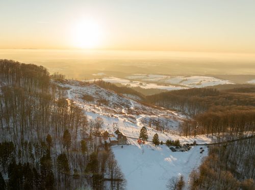 Free A beautiful winter sunrise over a snowy forest and landscape in Daruvar, Croatia. Stock Photo