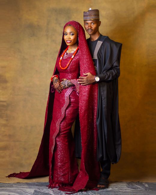 Elegant portrait of a Nigerian couple in traditional wedding attire.
