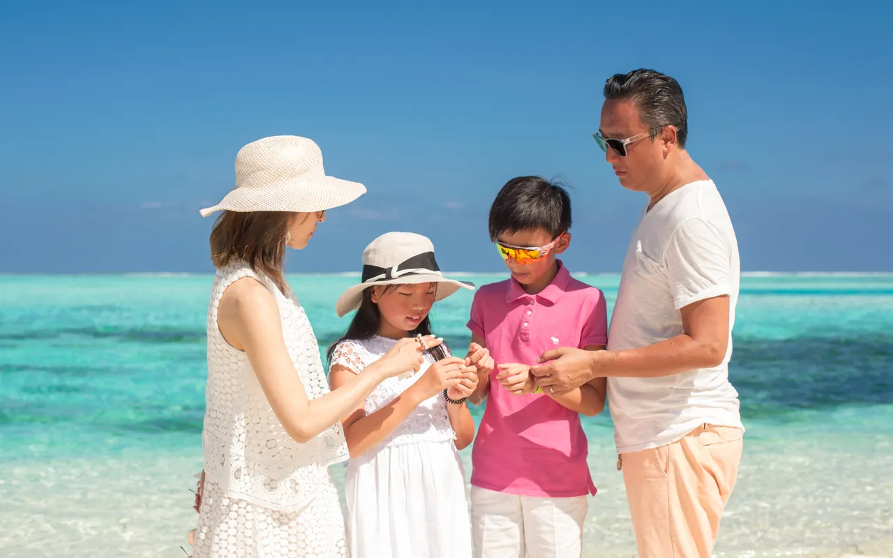 A family enjoying a sunny beach holiday