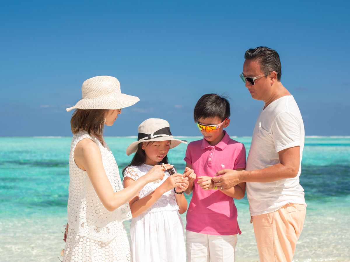 Family enjoying a beach vacation together