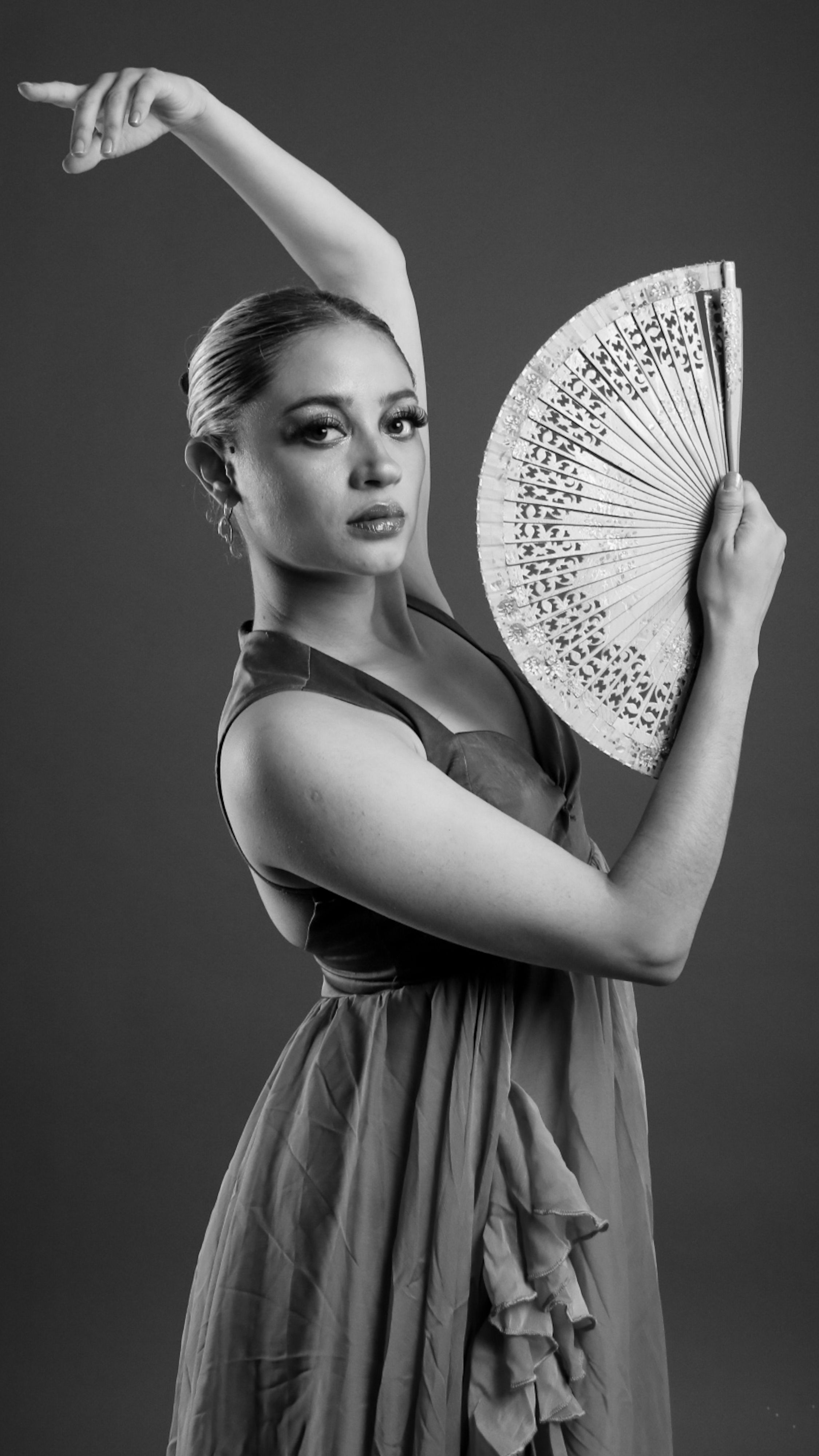 Graceful Flamenco Dancer with Fan in Black and White · Free Stock Photo