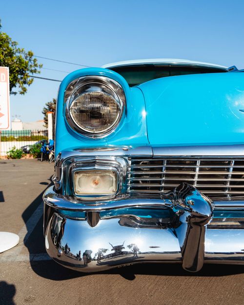 Free Front view of a classic 1950s blue car in Los Angeles, showcasing vintage charm and retro style. Stock Photo