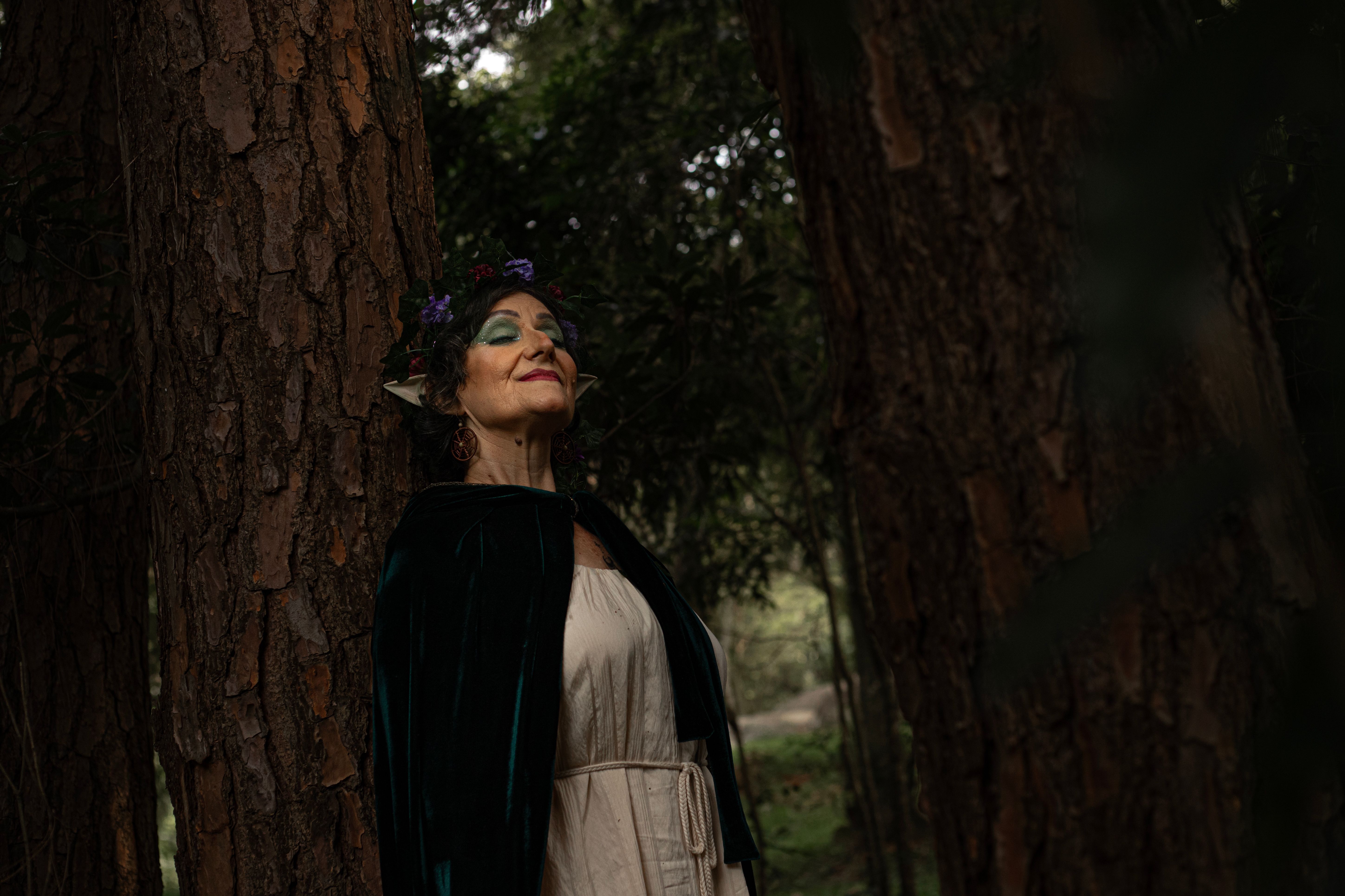 Ethereal Elderly Woman in Enchanted Forest · Free Stock Photo