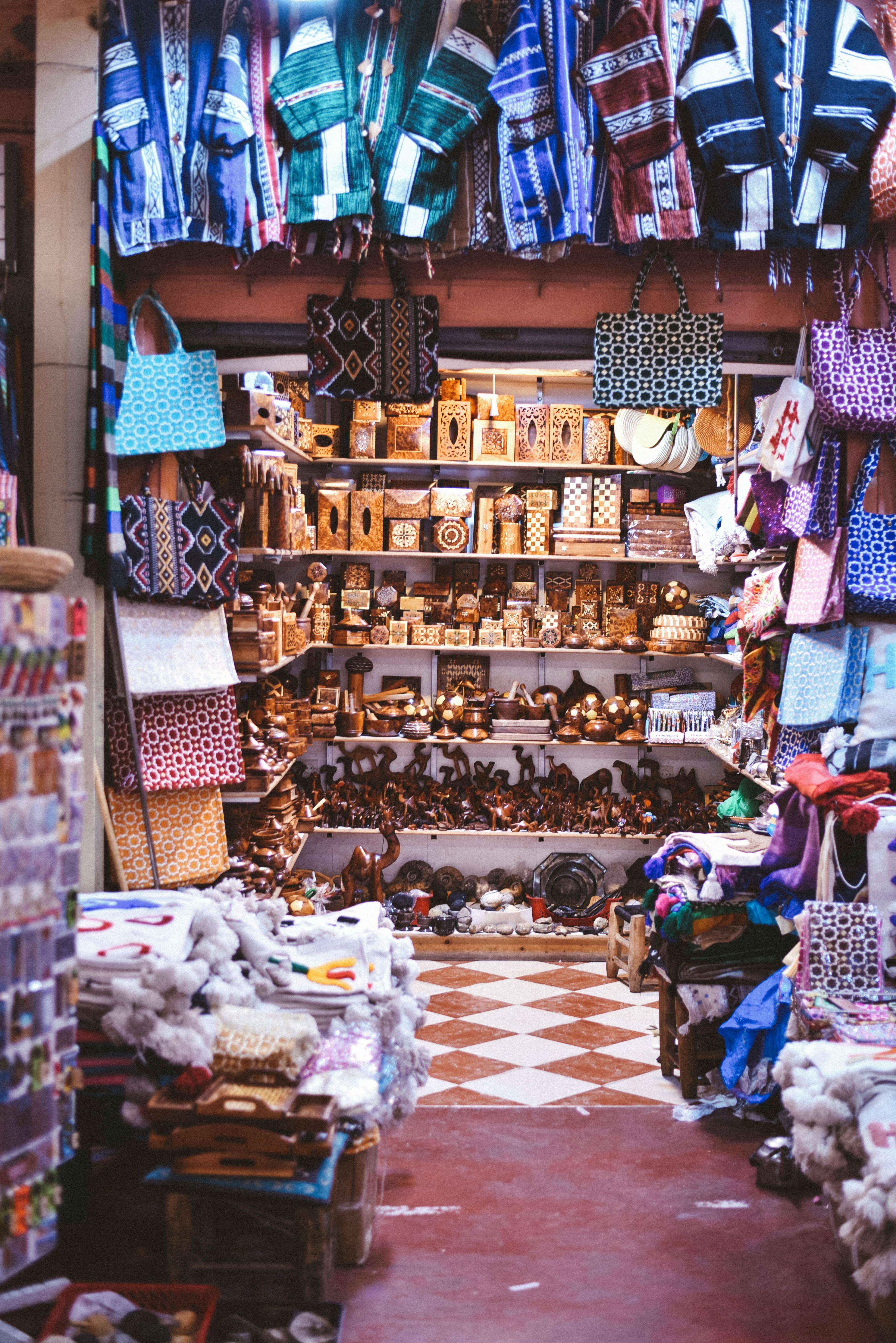 Stacked rattan bags, batik sarongs, and wood carvings at Sukawati Art Market — a starting point for what to buy in Bali