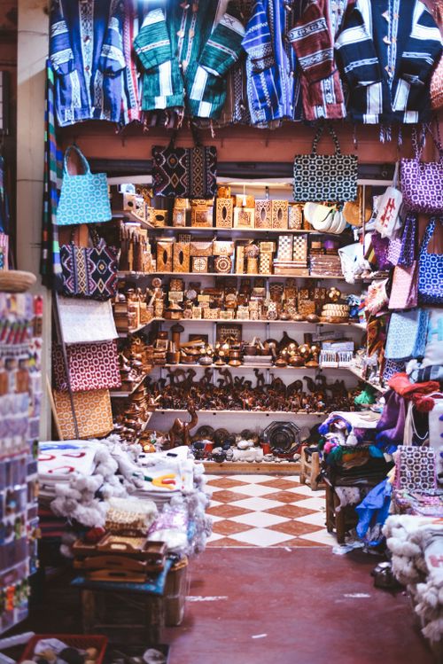 Free Vibrant display of handmade textiles and crafts in Agadir market. Stock Photo