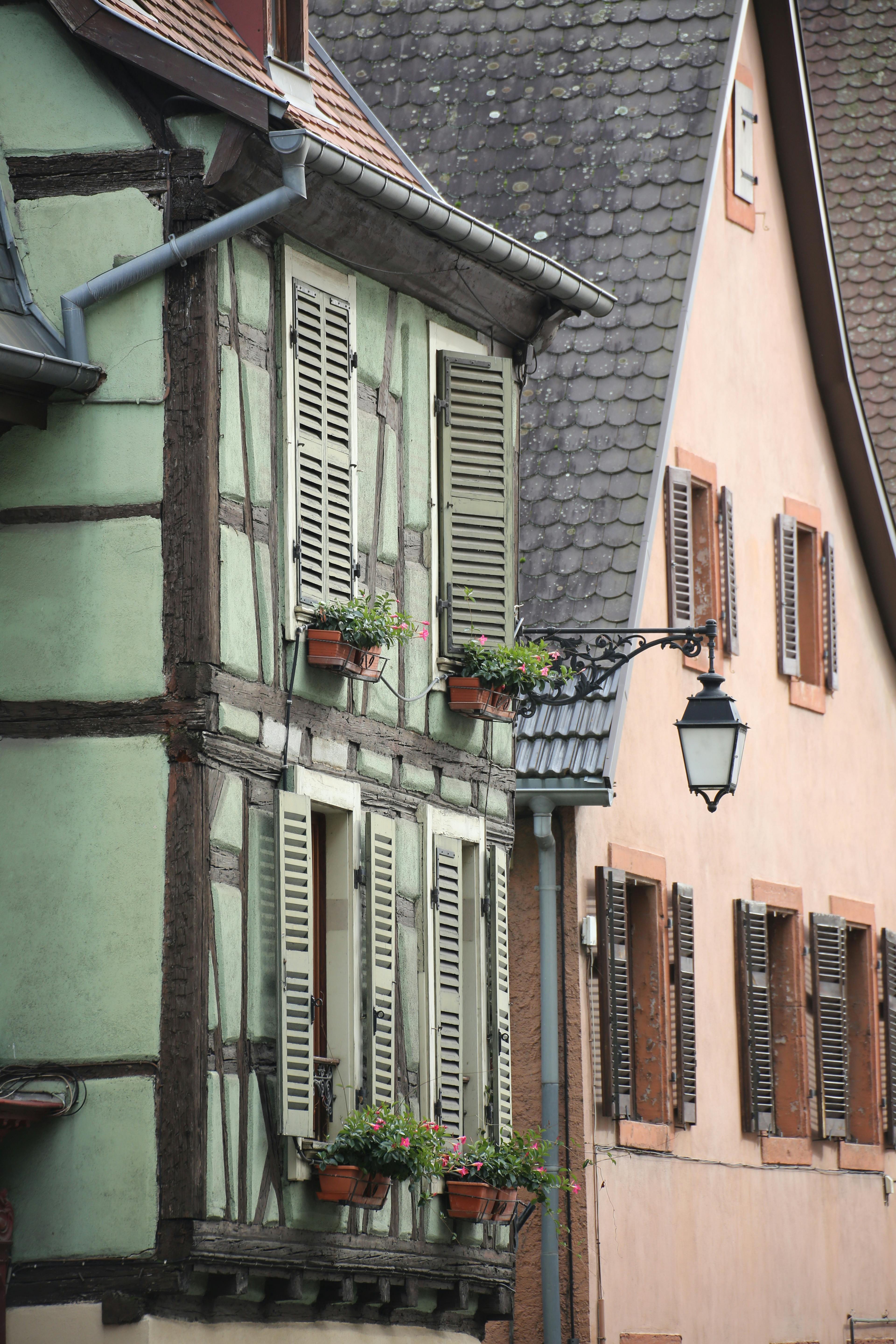 Charming half-timbered houses in a quaint European village street view.