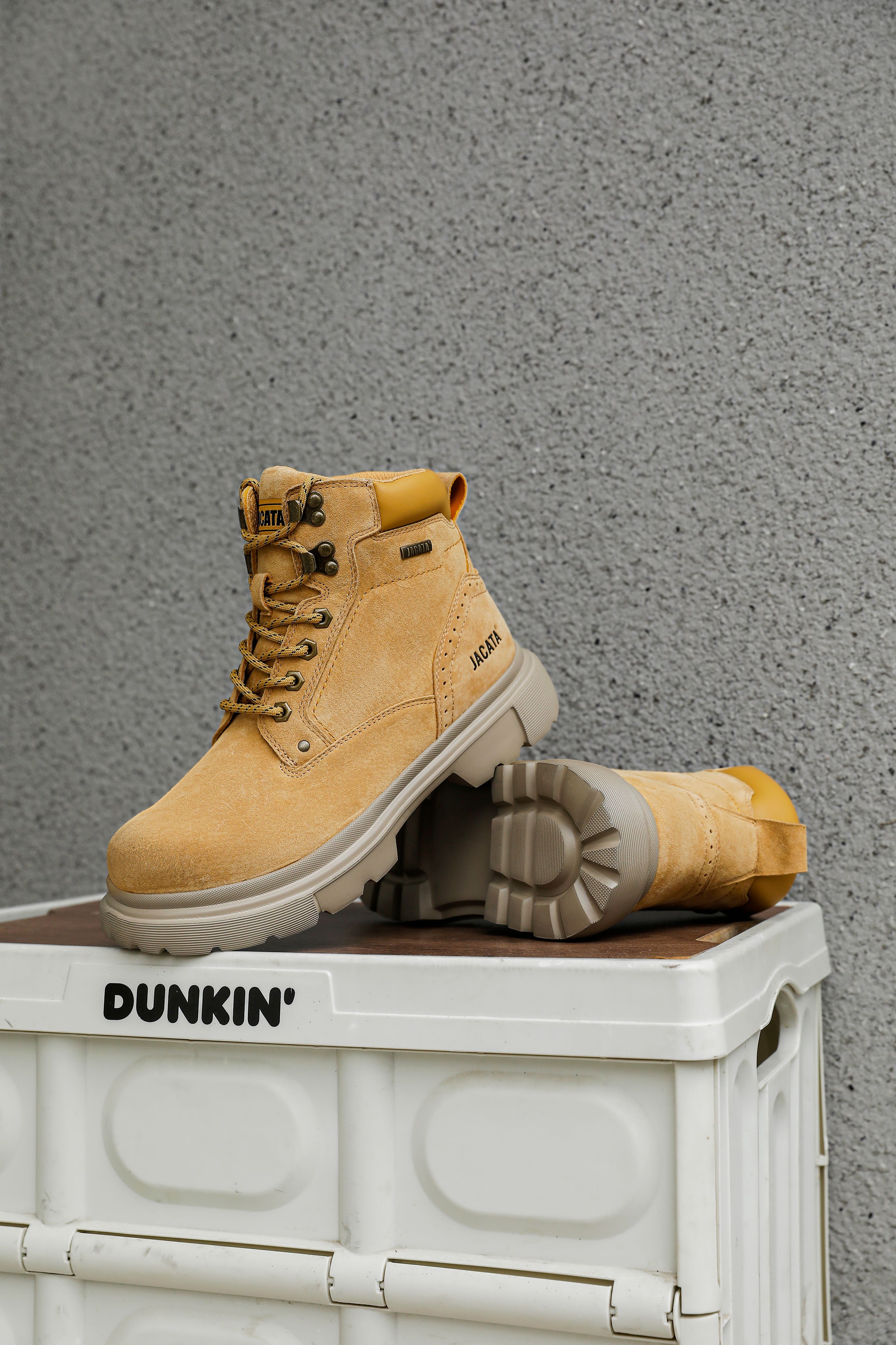 Stylish Tan Boots on Dunkin' Container · Free Stock Photo