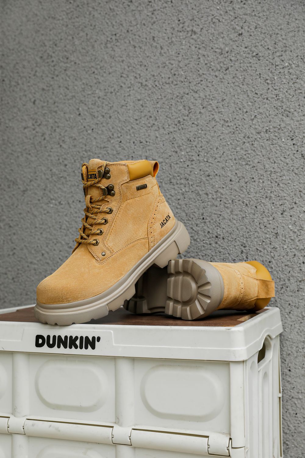Container Style Boots Stylish Tan Boots on Dunkin' Container · Free Stock Photo