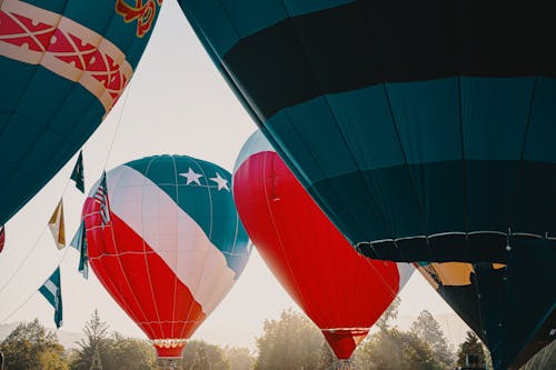 Inflated Multi-Colored Hot Air Balloons At Daylight
