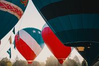 Inflated Multi-Colored Hot Air Balloons At Daylight