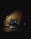 Moody Workspace with Laptop and Lamp