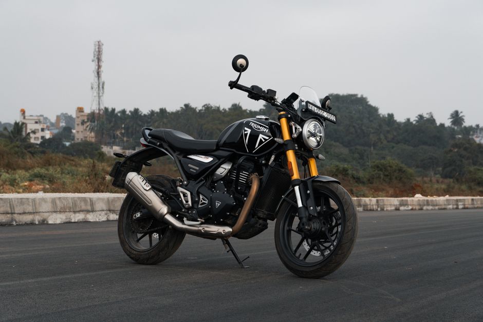 A Triumph motorcycle parked on an open road in Bengaluru, India.