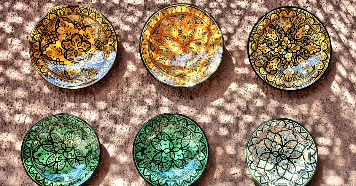 Traditional handcrafted green pottery plates from Tamegroute, Morocco — the distinctive ceramics village visited on day two of the Zagora desert tour