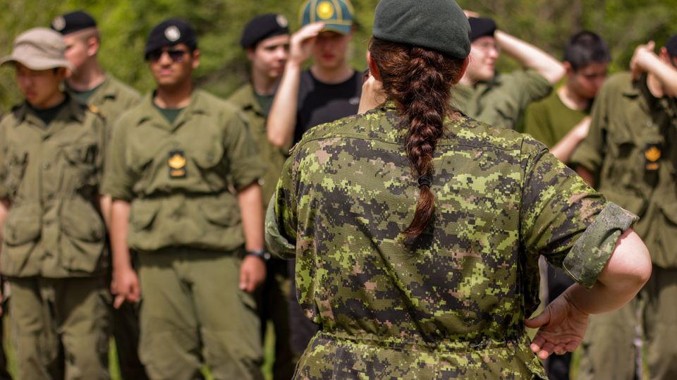 Group of uniformed participants practising together outdoors